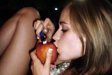 Stoner girl smoking an apple pipe